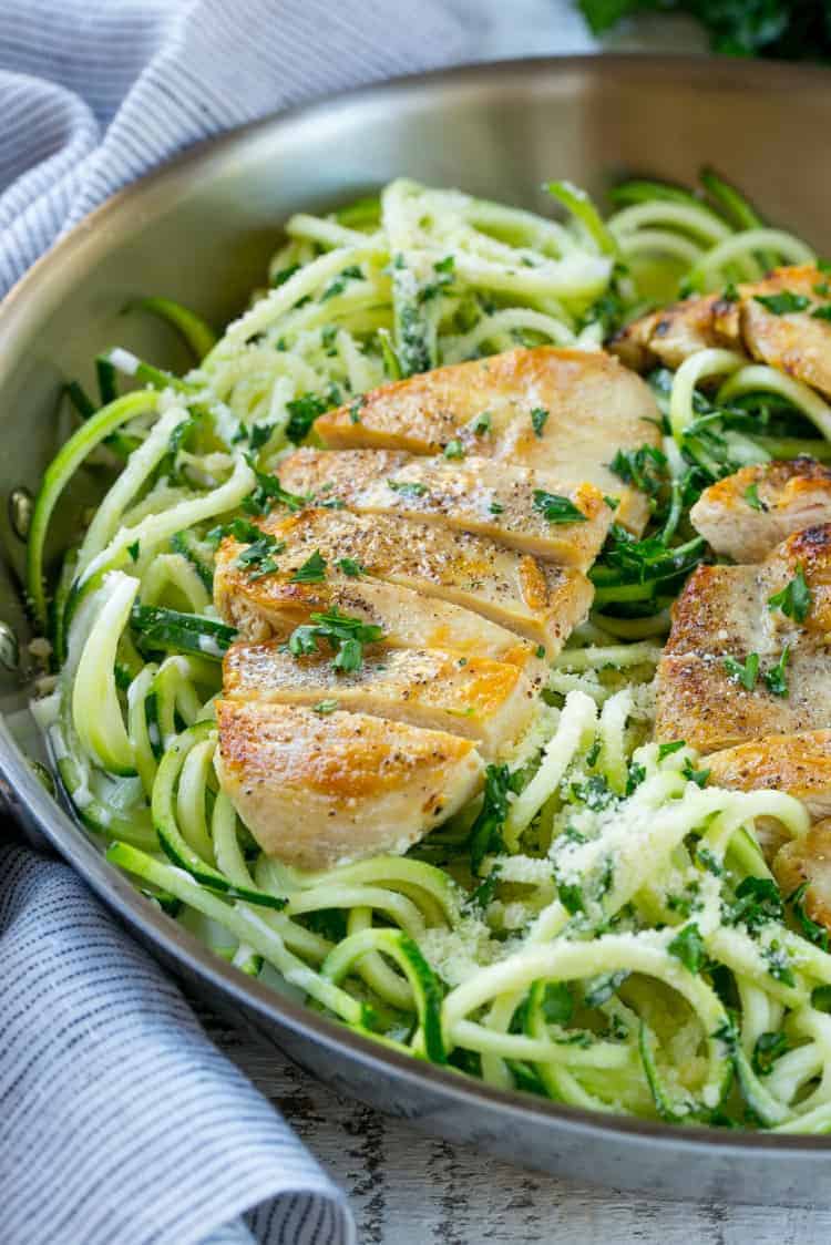 chicken breast over vegetable noodles for healthy chicken alfredo recipe 