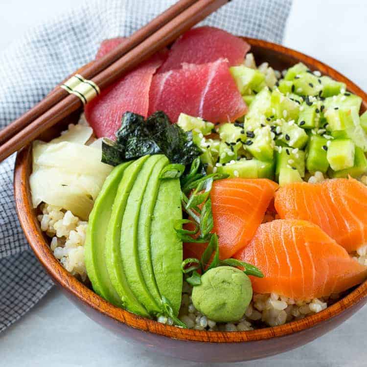 sushi rice in bowl with fresh veggies 