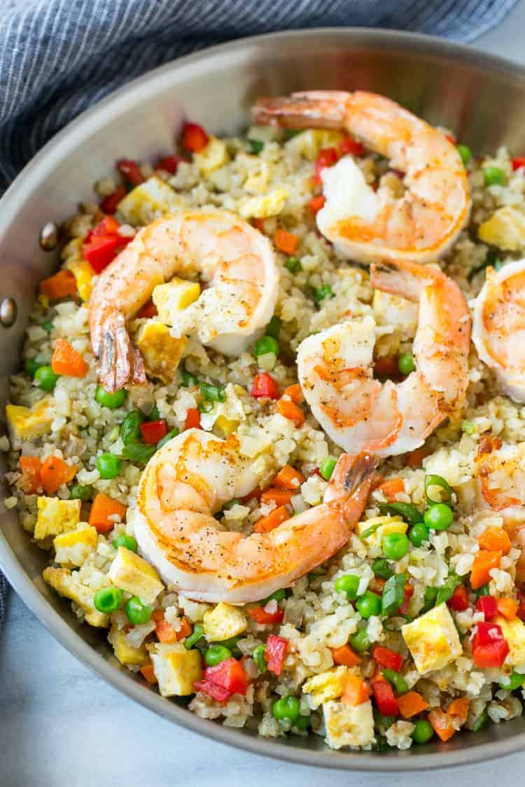 fried rice with cauliflower and shrimp in pan 