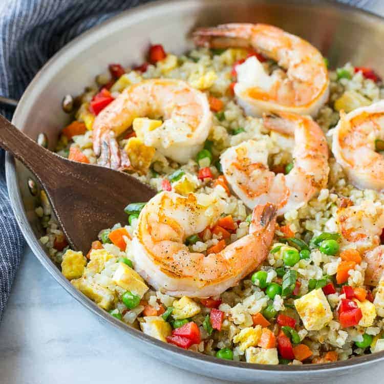 Shrimp Cauliflower Fried Rice in silver pan with wooden spoon 
