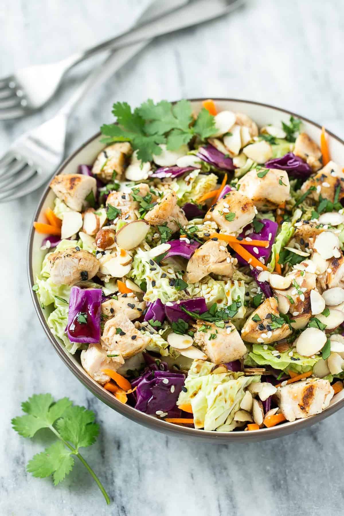 chicken salad in a bowl on flat white surface