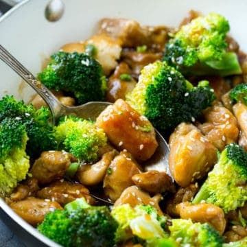 Chicken and Broccoli Stir Fry Recipe in pan with sauce and sesame seeds