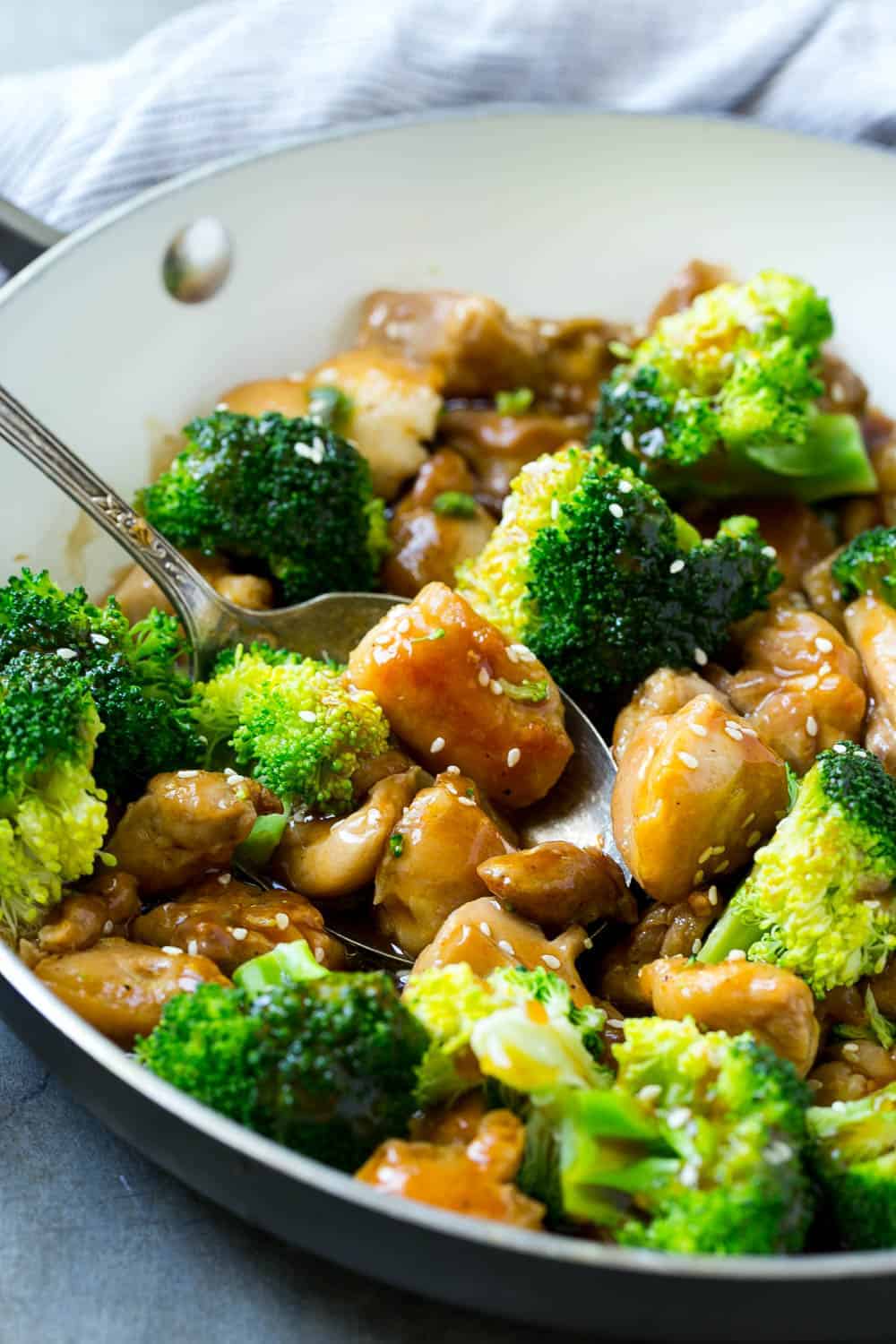 chicken and broccoli in bowl with sauce 