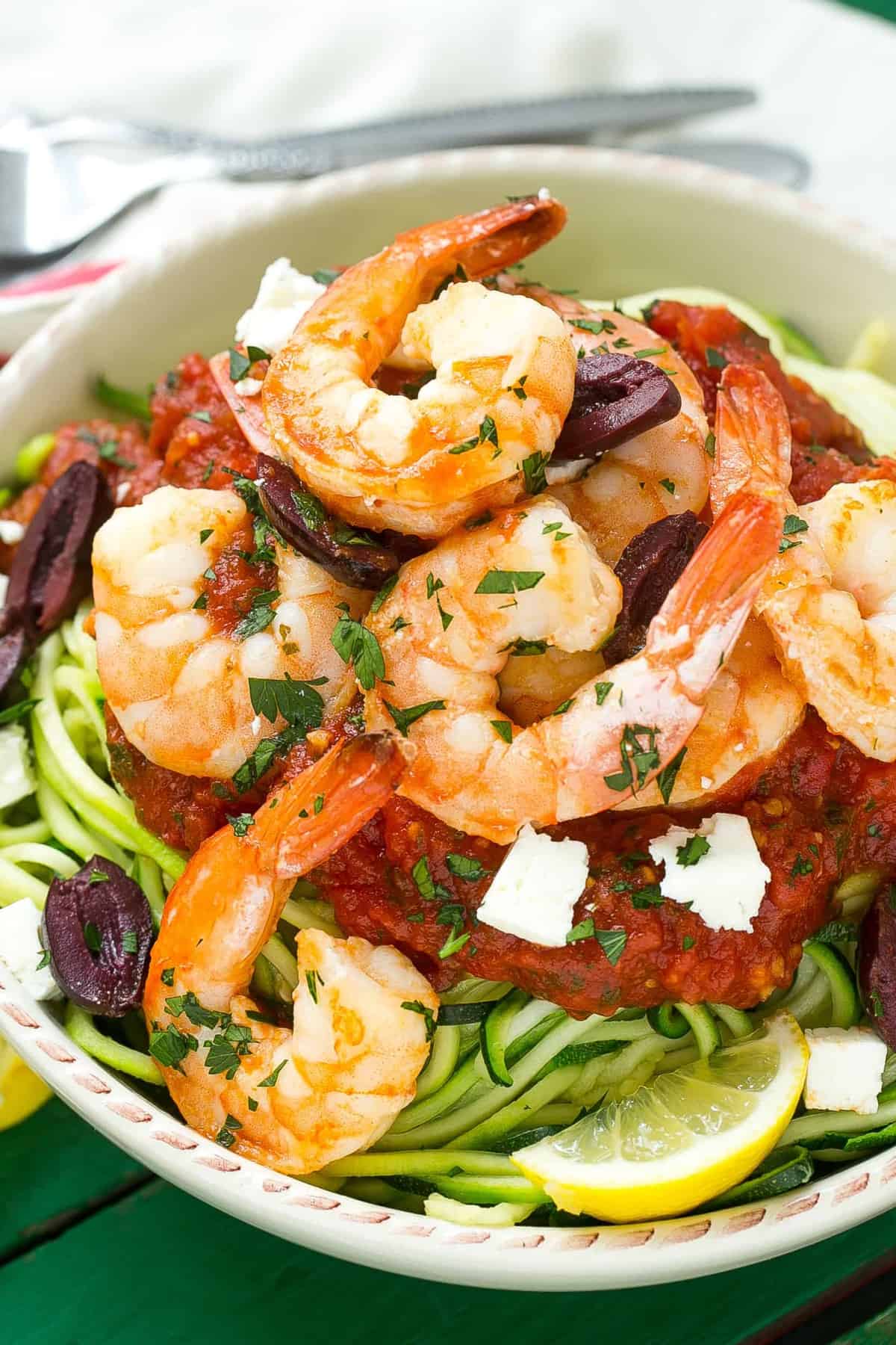 shrimp over zucchini noodles in a bowl