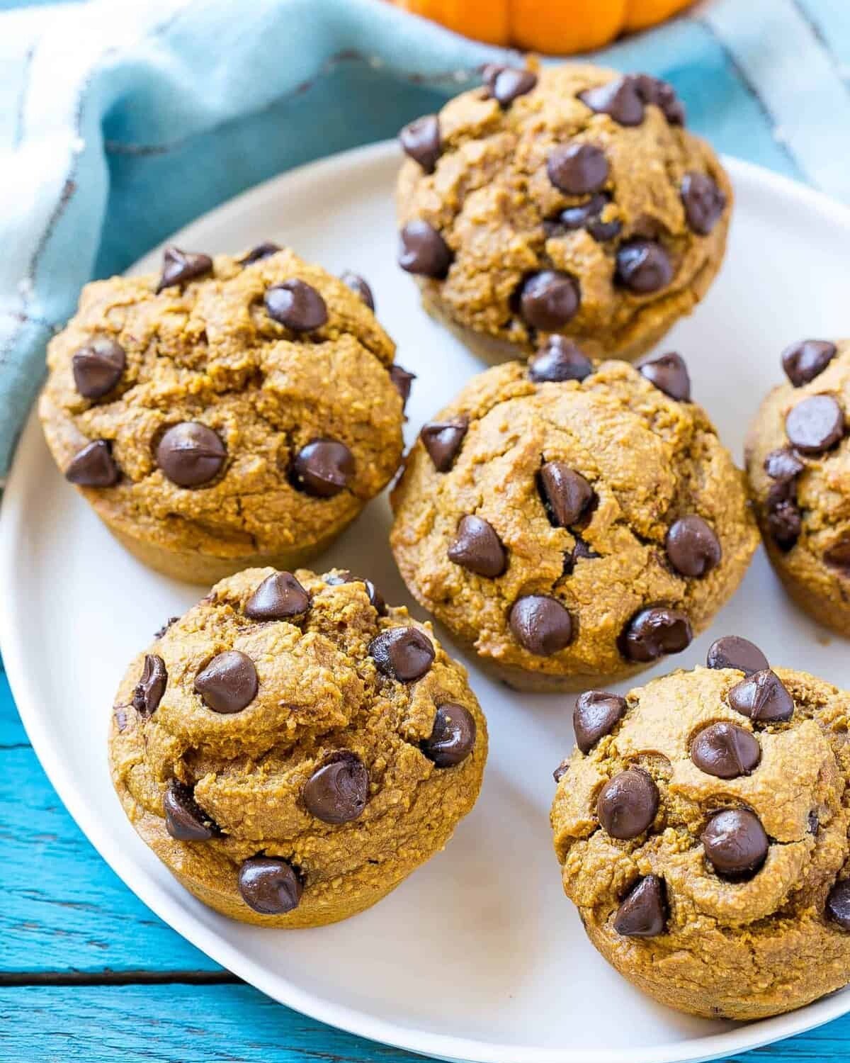 pumpkin Muffins with chocolate chips on a white plate.