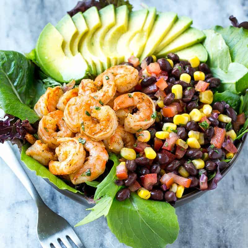 salad bowl with shrimps salsa and avocado