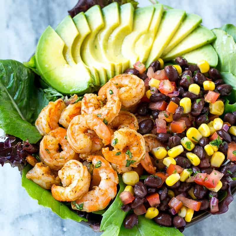 salad bowl with shrimps salsa and avocado