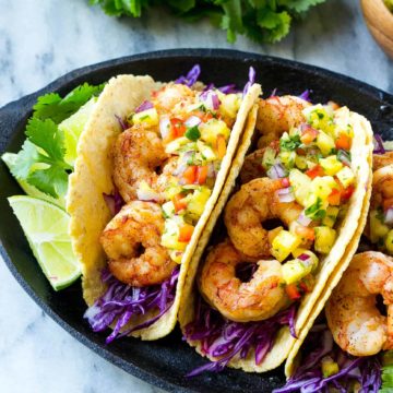 three shrimp tacos on plate