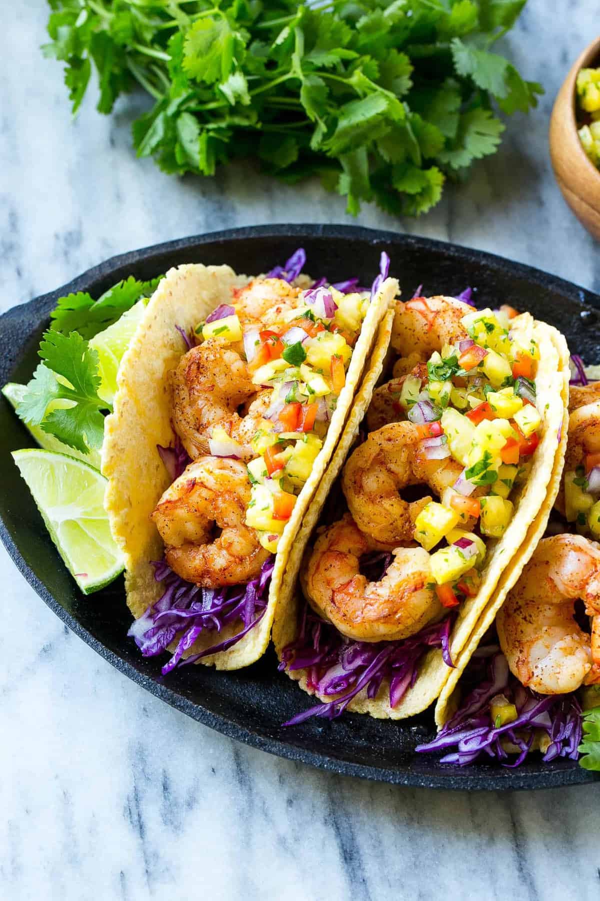 three shrimp tacos on plate