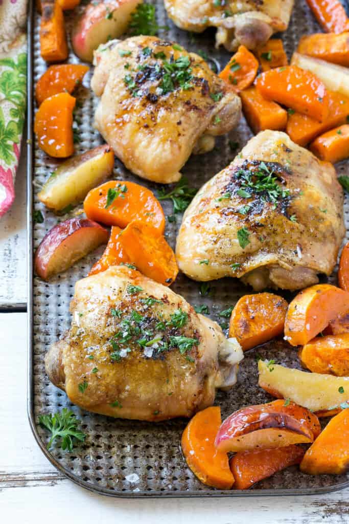 Roasted Chicken Thighs with sweet potato and apples on a sheet pan