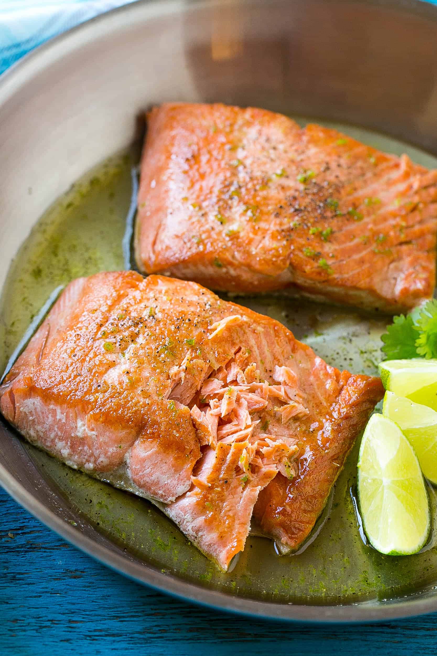 The fish in a pan with part of it flaked