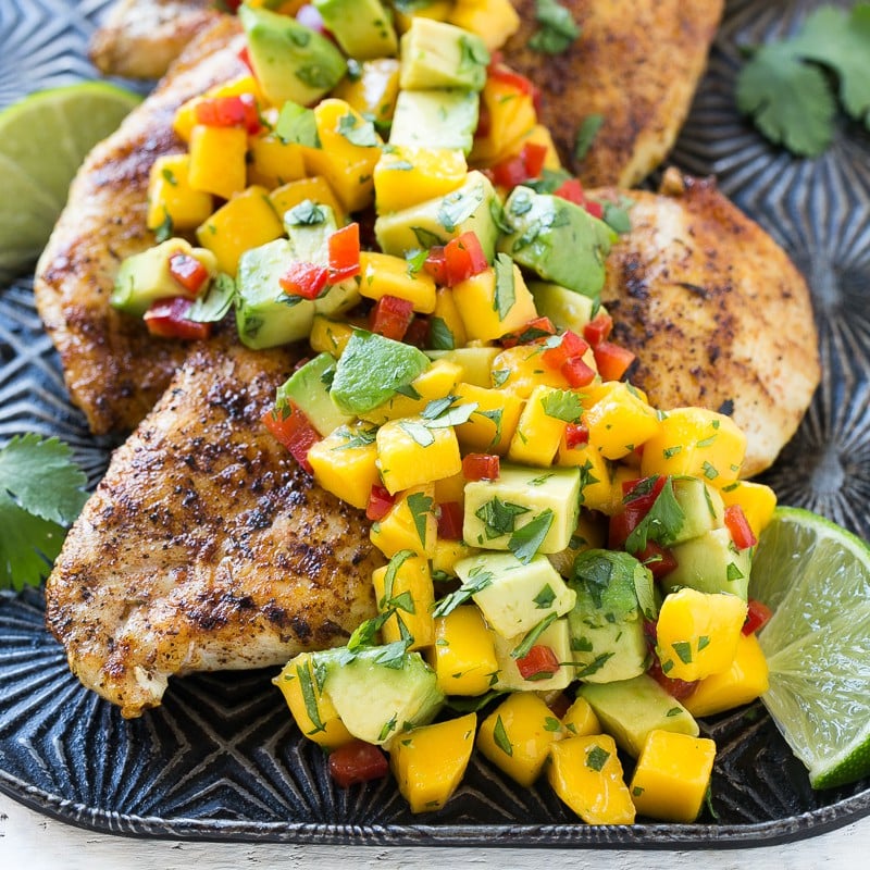 chicken topped with mango avocado salsa 