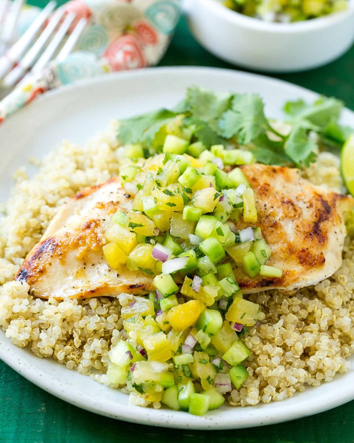 Grilled chicken breast over quinoa topped with pineapple salsa.