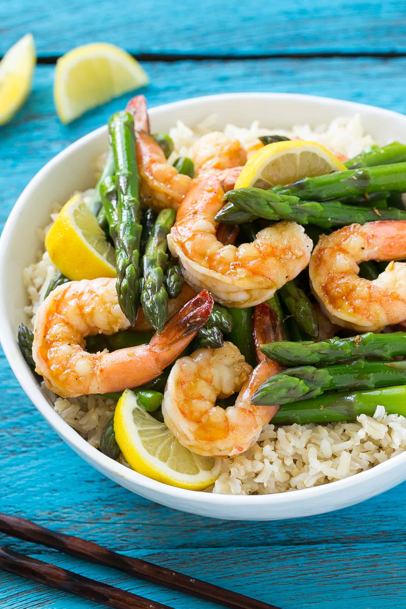 lemon ginger shrimp and asparagus in a bowl with rice