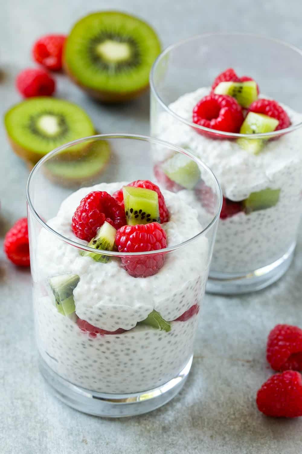 easy Coconut Chia Pudding in two glasses with fruit 