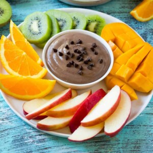 chocolate fruit dip surrounded by fruit