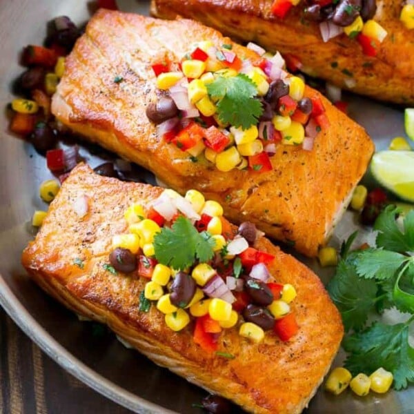 overhead shot of Southwestern Salmon pan seared fillets on a pan topped with corn salsa