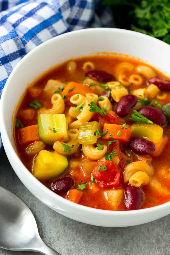 close up of Vegetable Minestrone Soup in a white bowl