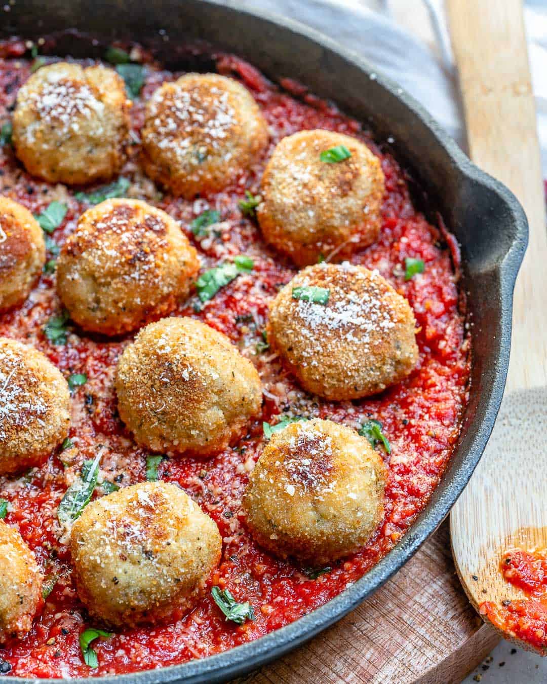 skillet with tomato sauce and chicken meatballs 