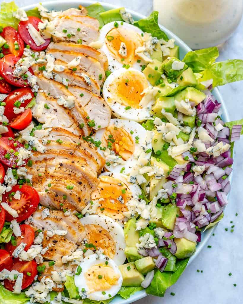 top view of half a bowl of chicken cobb salad 