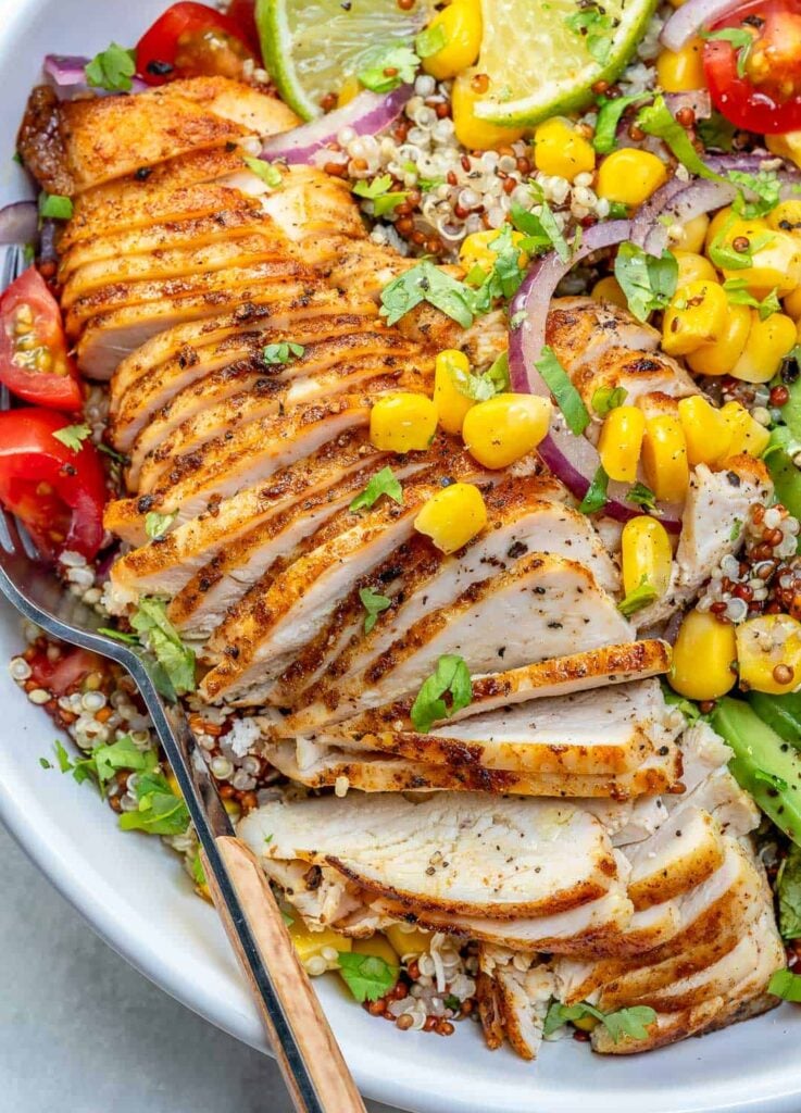 close up view of Mexican grilled chicken with quinoa corn and tomatoes