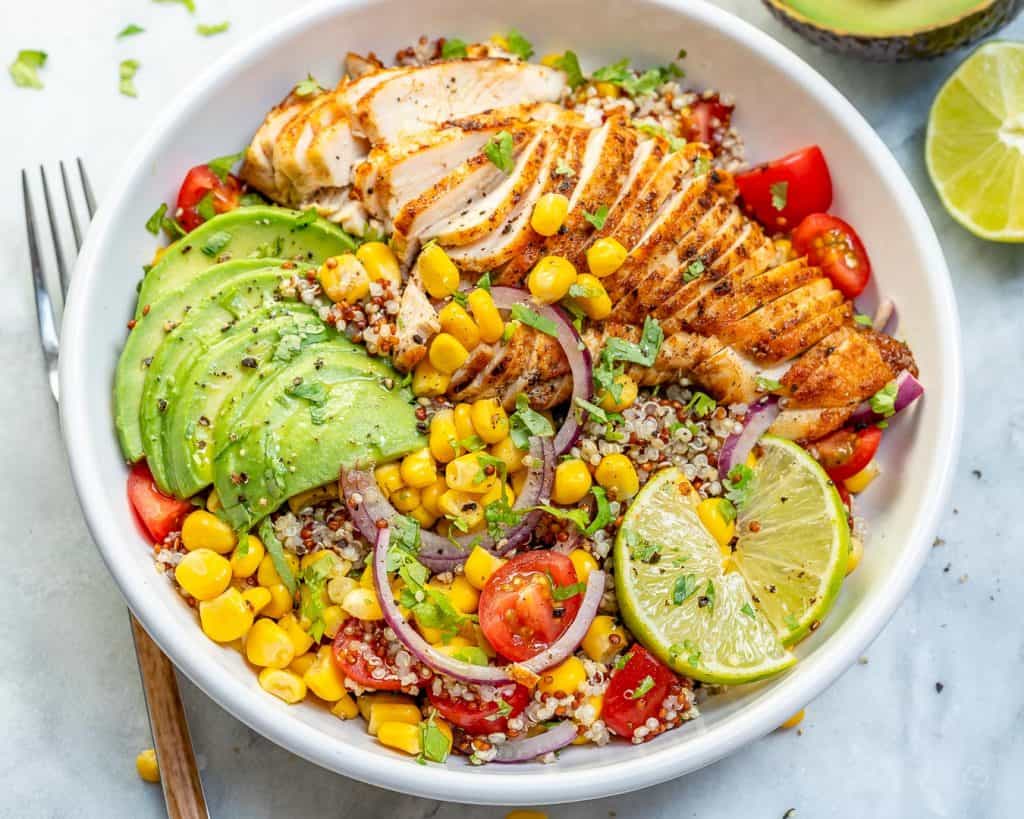 top view of a bowl of Mexican grilled chicken with quinoa corn and chopped avocado