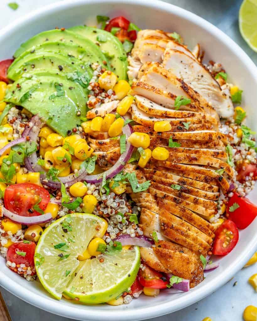 top view of a bowl of Mexican grilled chicken with corn quinoa and avocado