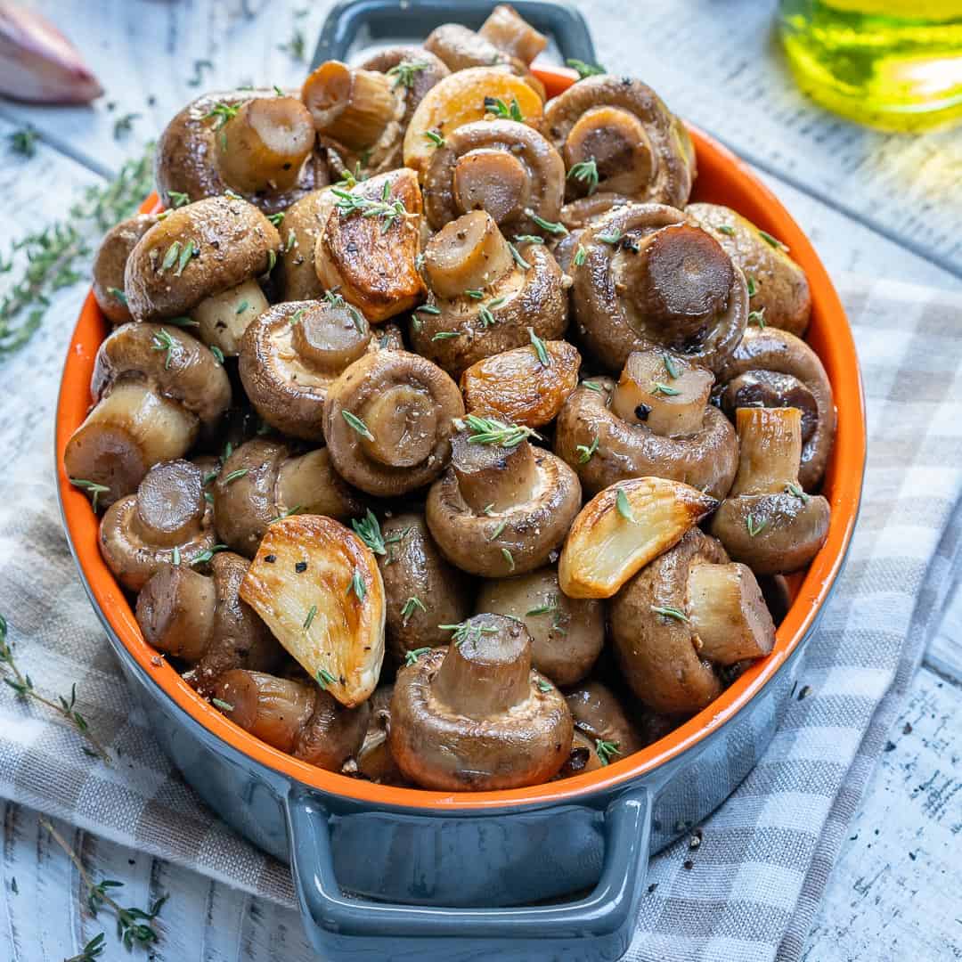 roasted mushrooms in dish with thyme and garlic