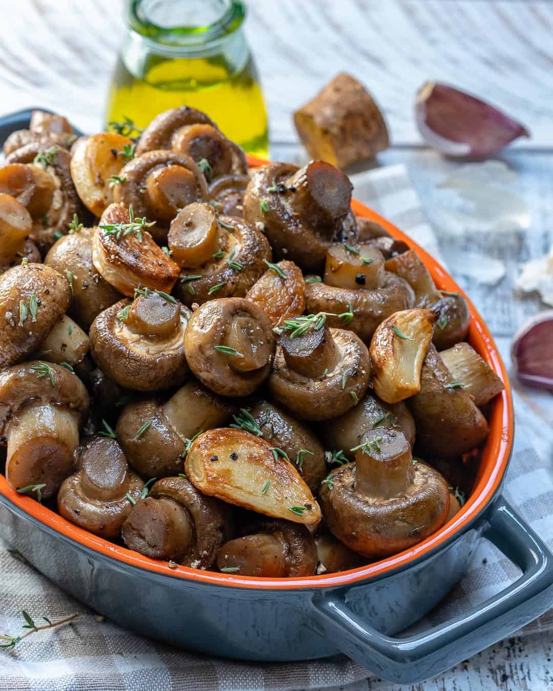 one bowl of garlic butter mushrooms with thyme