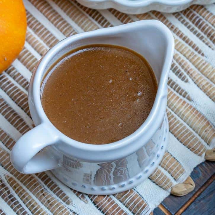 turkey gravy recipe in a serving cup on a table 
