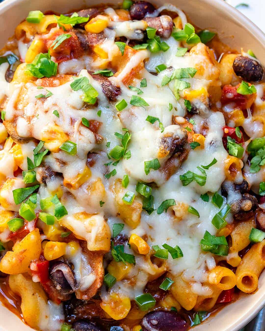 easy chili topped with cheese and green onions