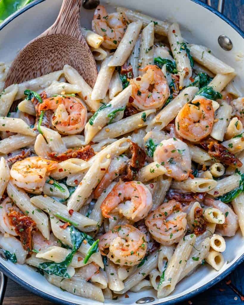 pasta with sun-dried tomatoes and shrimp in a skillet