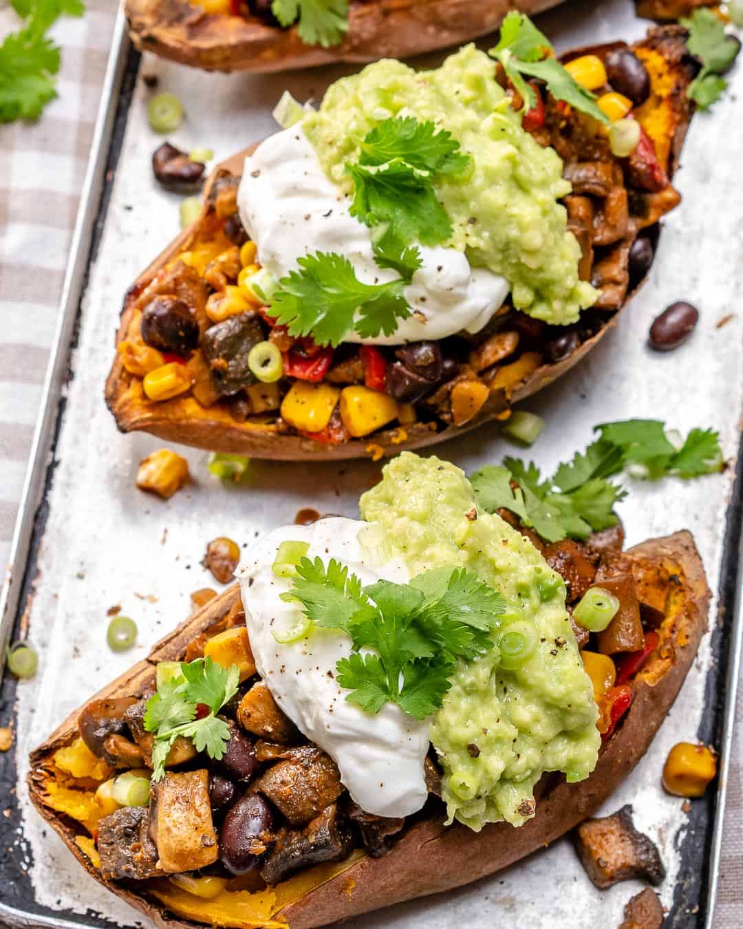 vegetarian taco stuffed sweet potatoes on baking tray 