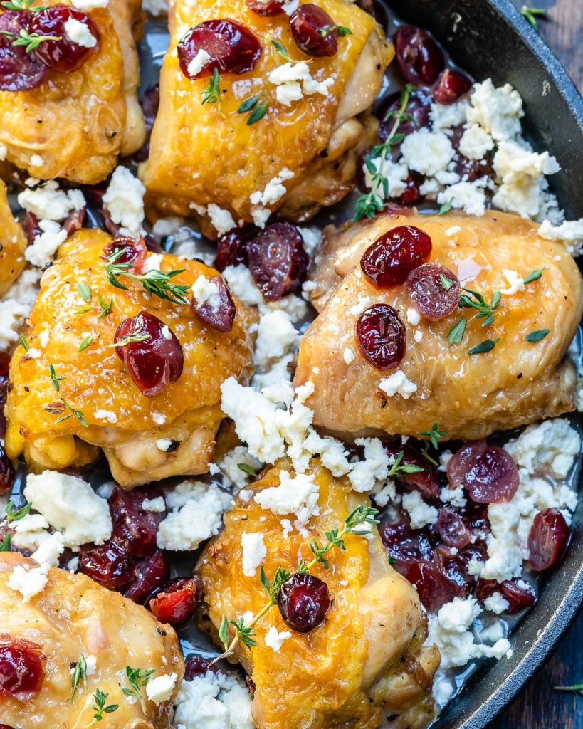 close up chicken thighs roasted with cranberries and cheese
