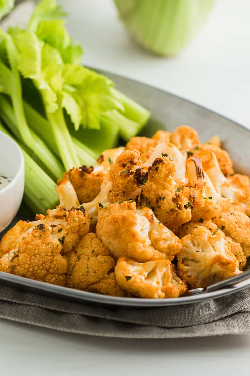 cooked buffalo cauliflower wings with celery