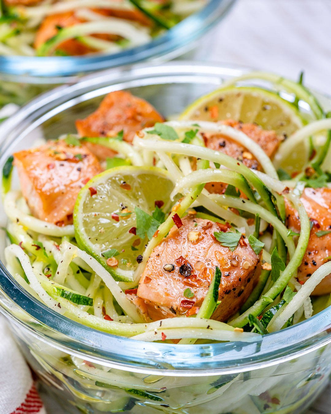 close up of salmon bites in a container.