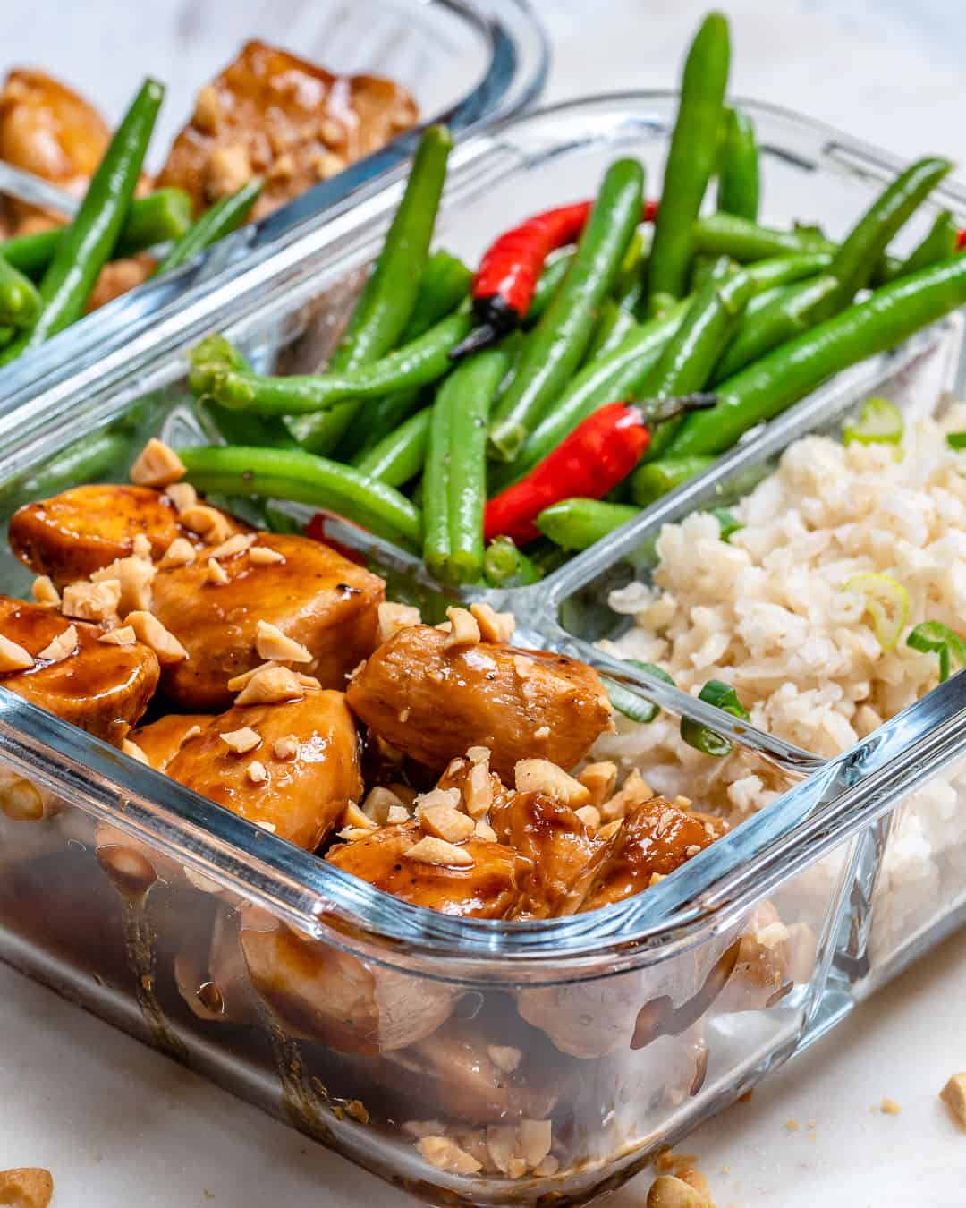 side shot of Sweet and Spicy Chicken in a glass container.