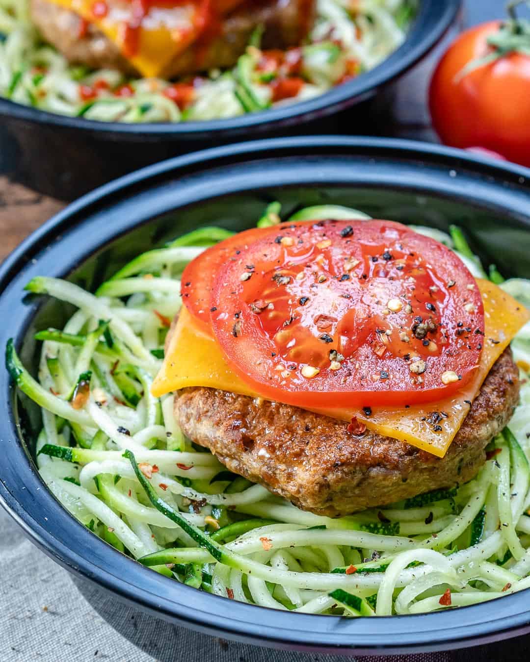 https://healthyfitnessmeals.com/wp-content/uploads/2019/02/Turkey-burger-and-zoodles-2.jpg