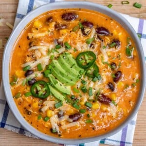 top view of chicken enchilada soup in a round bowl