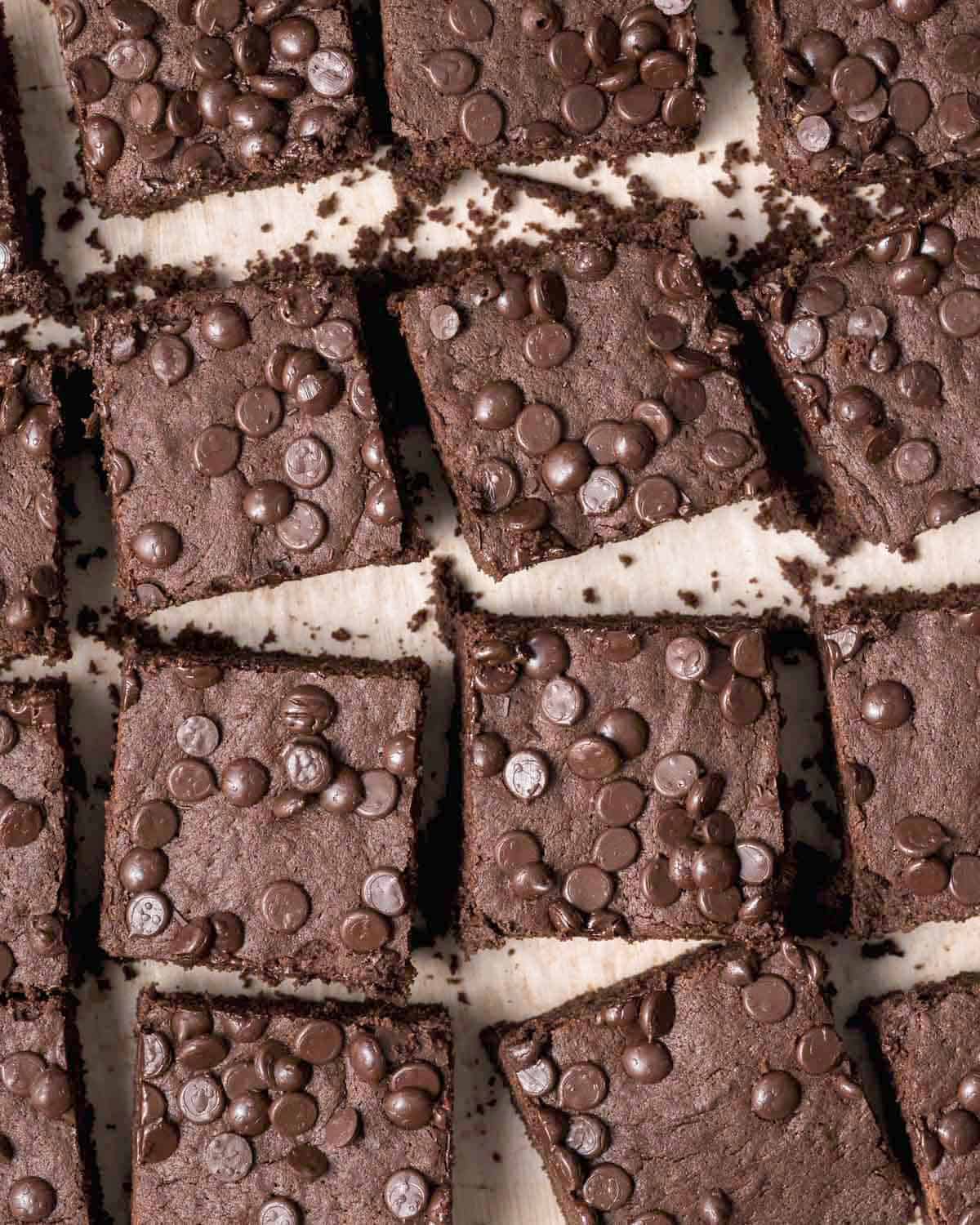 brownie square bars next to each other on a flat surface.