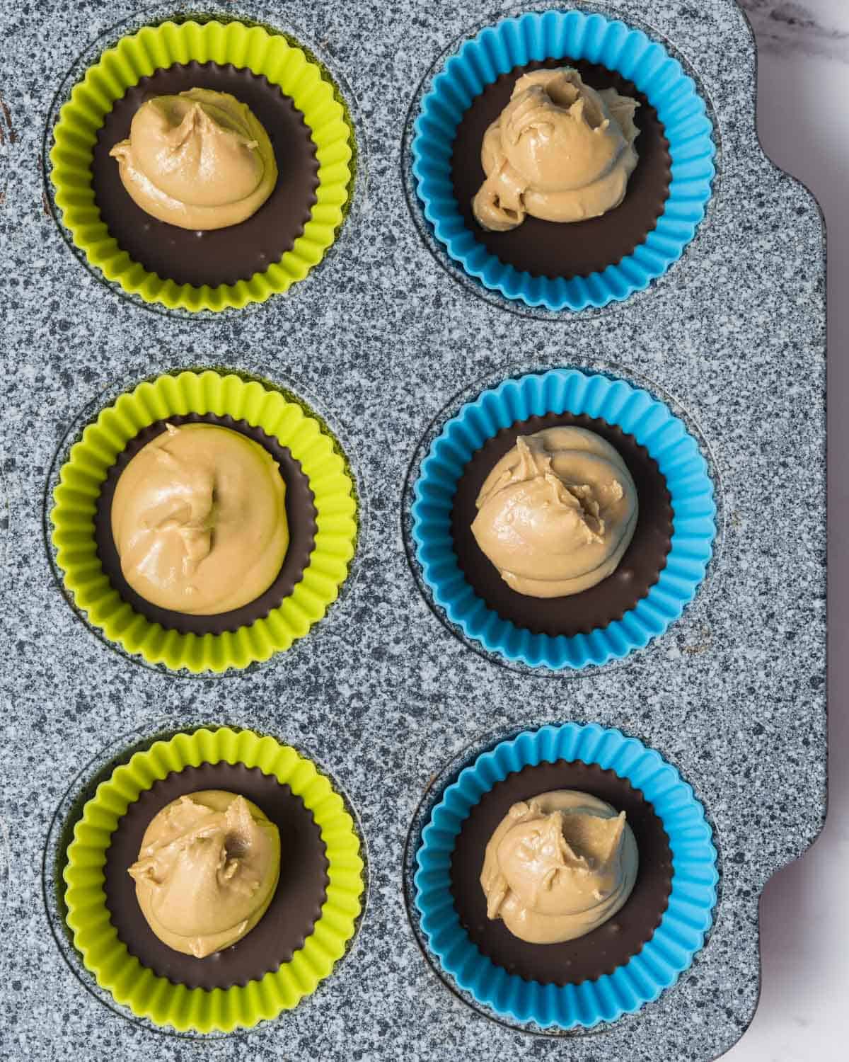 peanut butter protein mixture added over each mold.