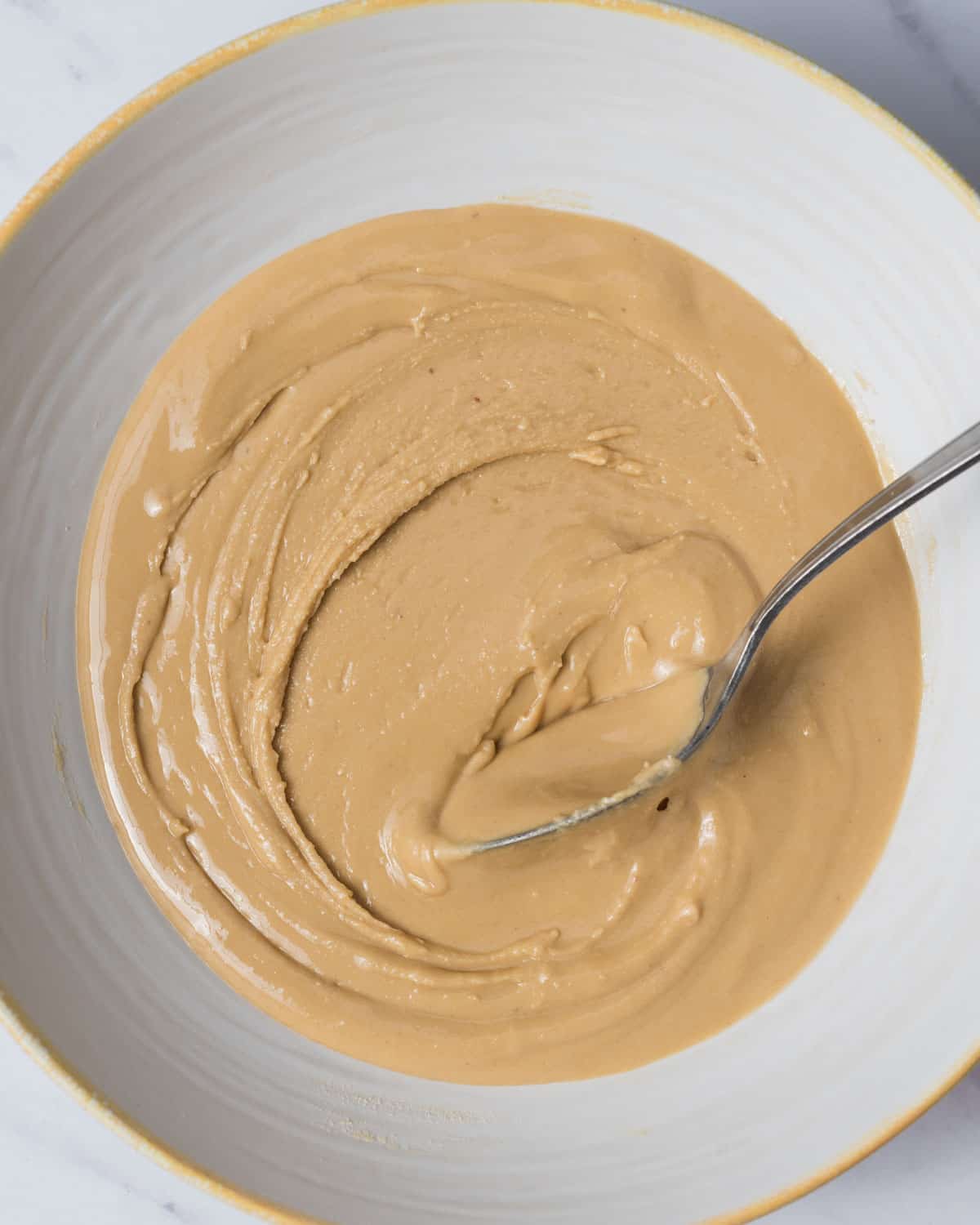 peanut butter and protein powder mixed together in a bowl until smooth.