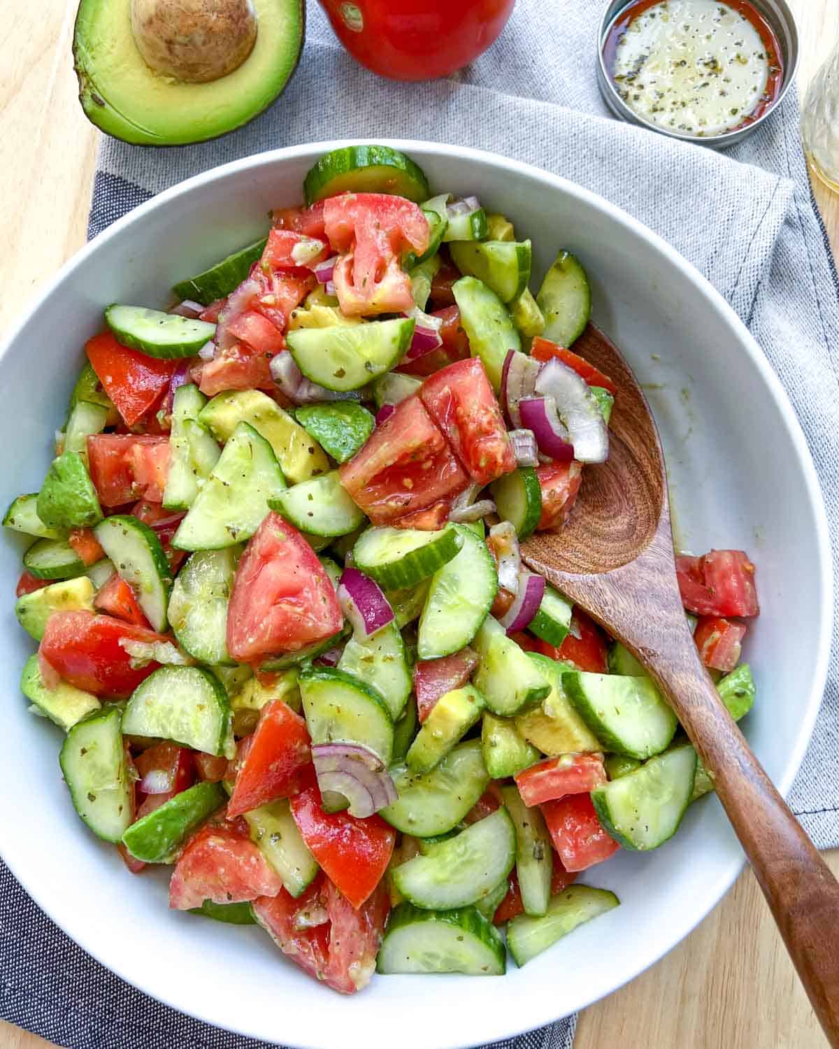 wooden spoon in a white salad bowl.