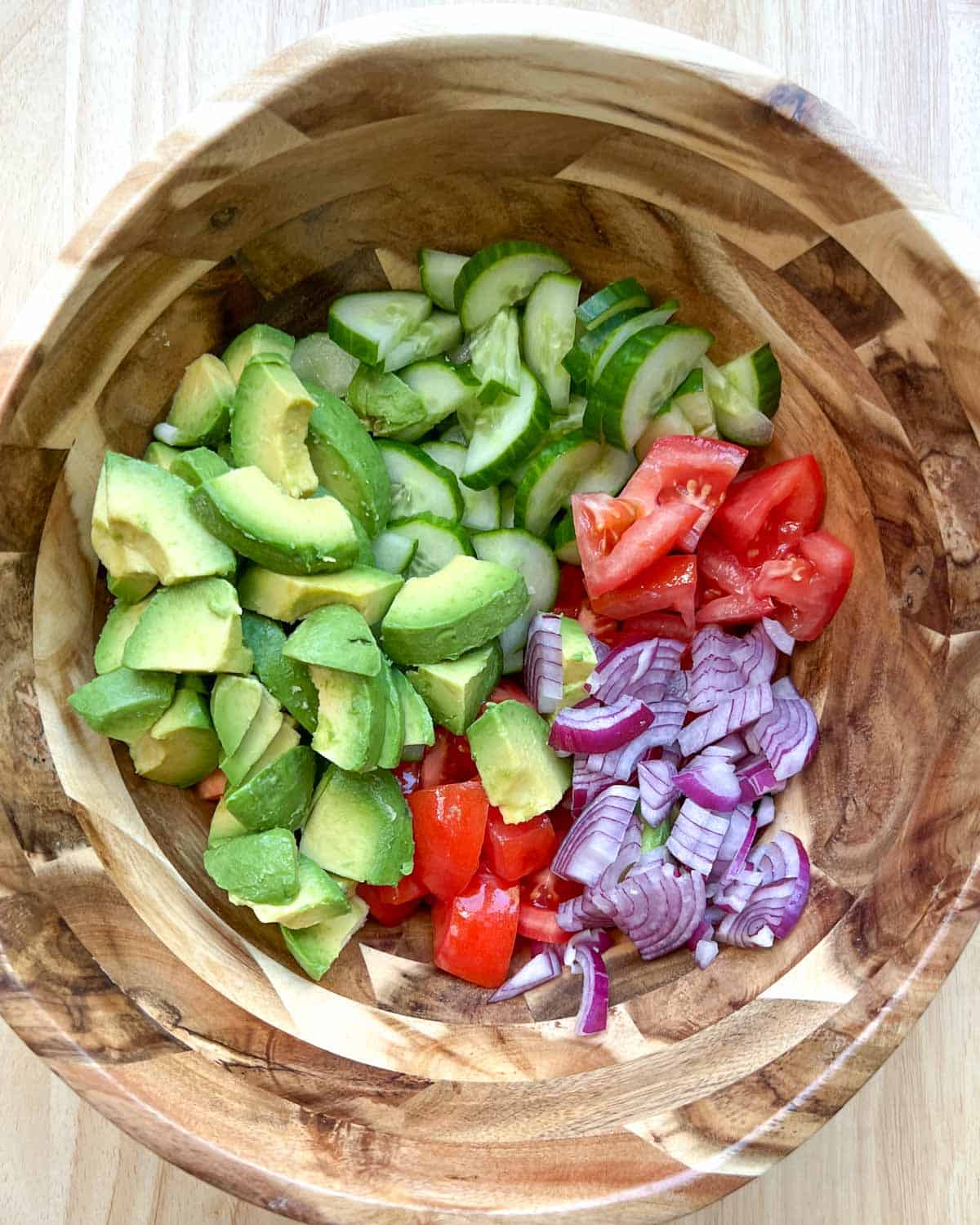 all veggies placed in a large wooden bowl.