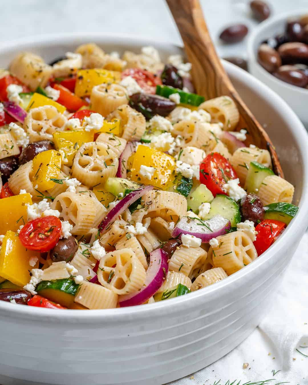spoon in Greek Pasta Salad recipe