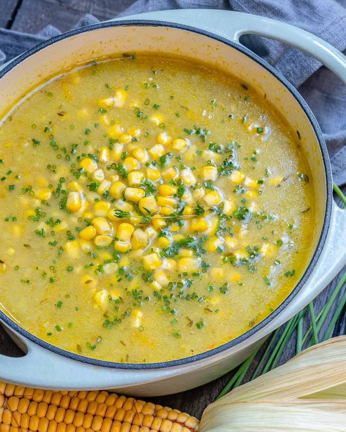 A pot filled with corn chowder.