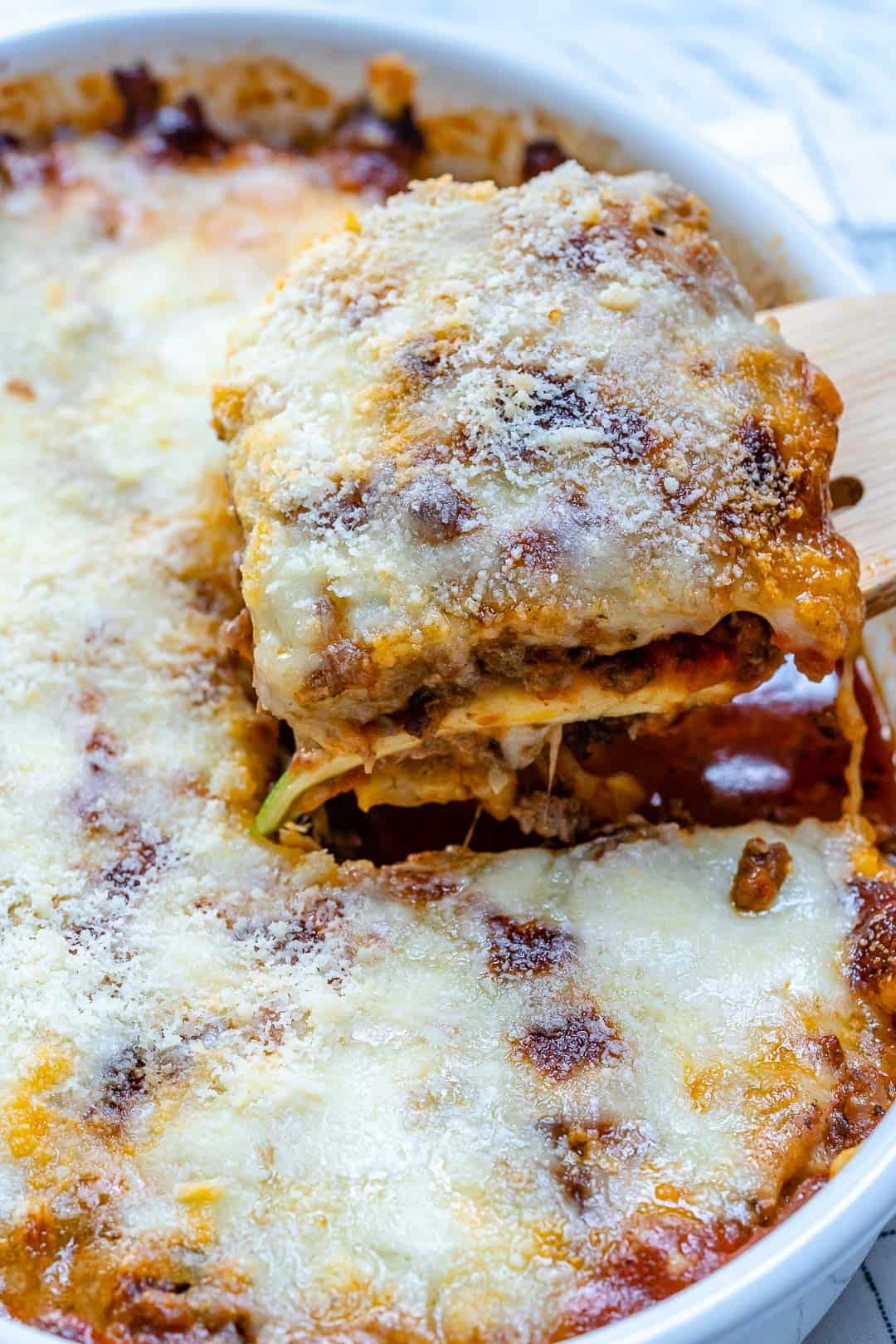 wooden fork lifting up a slice of Zucchini Lasagna 