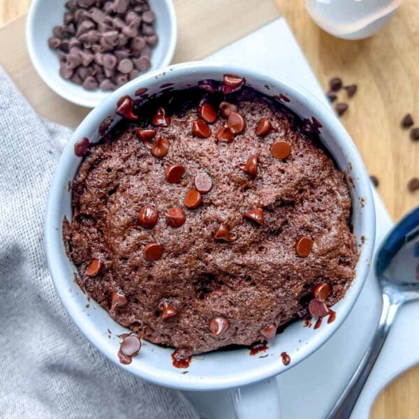 a cup of chocolate cake topped with chocolate chips.