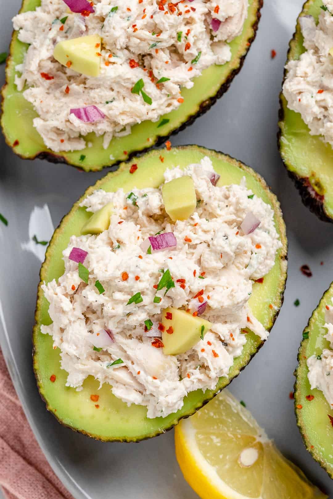 top down shot of healthy chicken salad in avocados