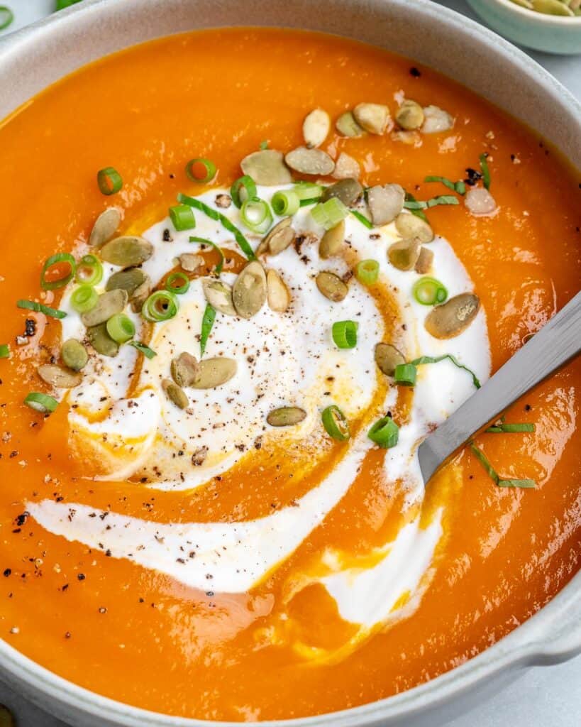 close up pumpkin soup with sour cream